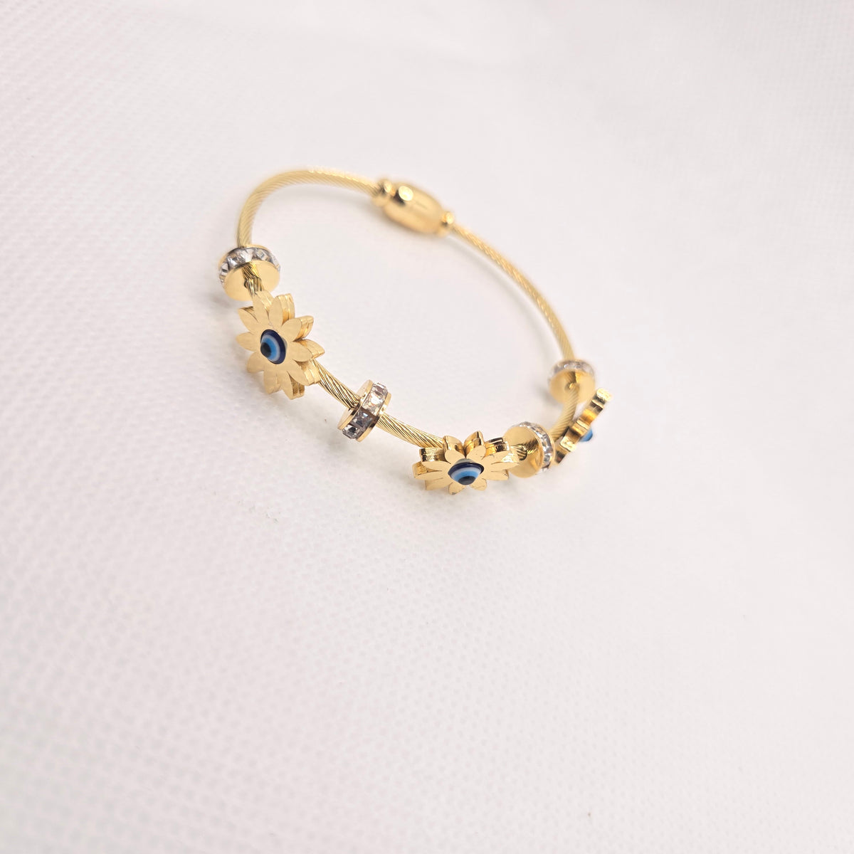 Gold-Toned Blue Centre Flower Charm Bangle