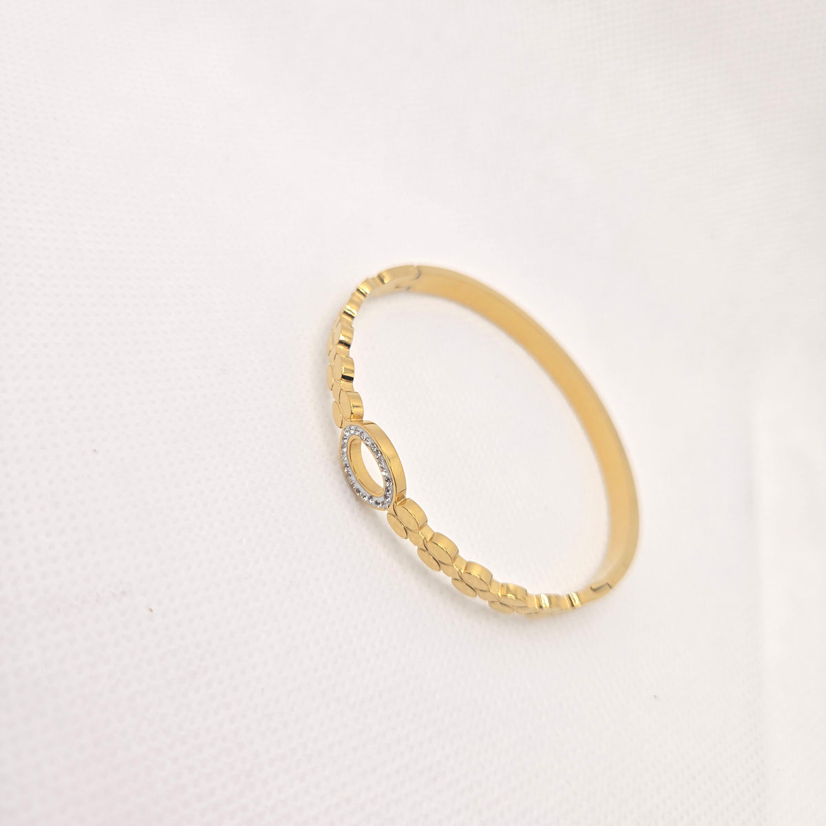 Gold-Toned Oval Openwork Bangle with Clear Accents
