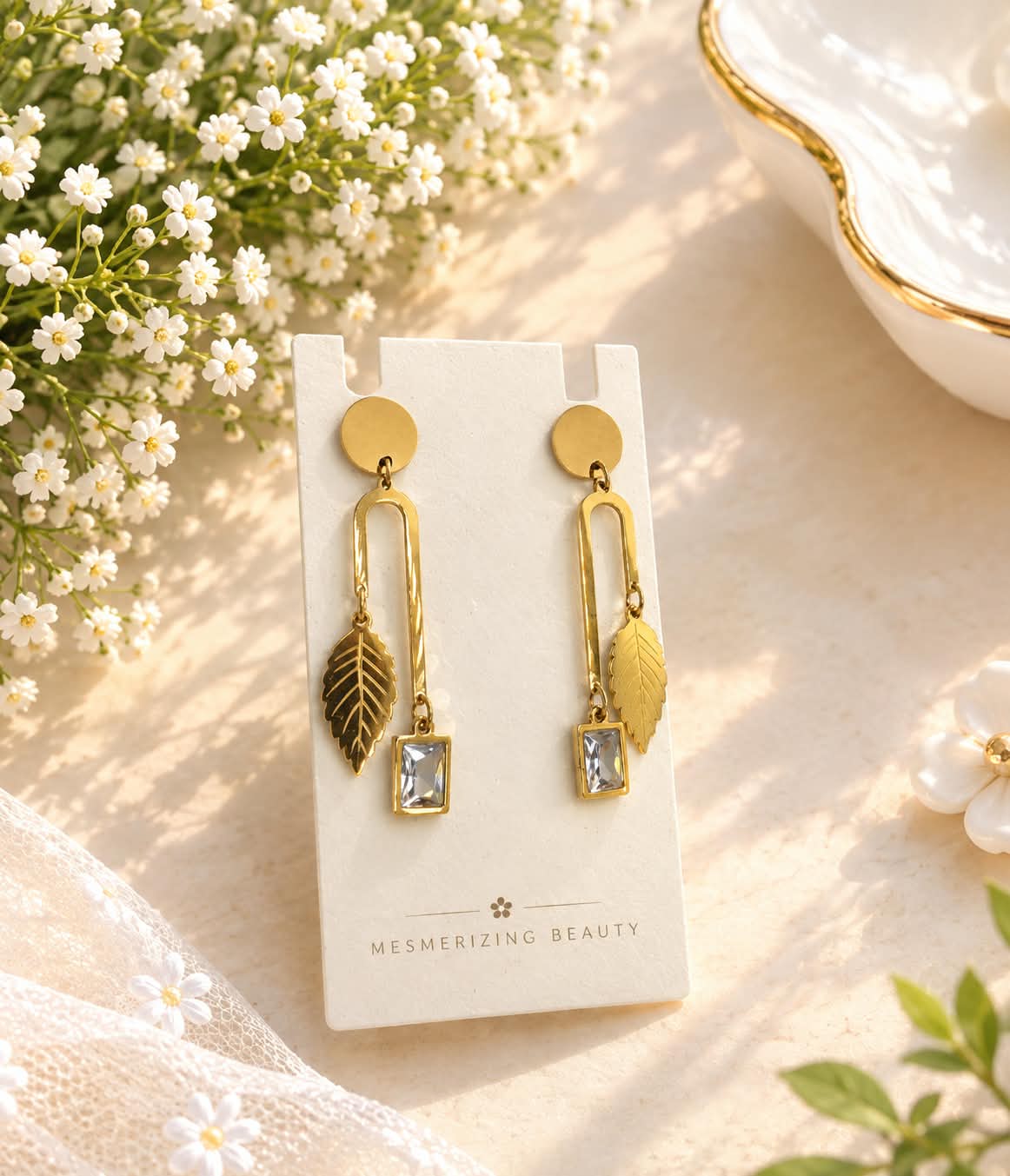 Gold-Toned Leaf and Clear Stone Drop Earrings
